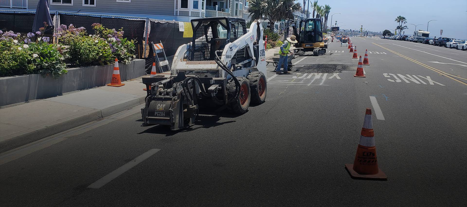 MAG Engineering crew installing underground utilities in a coned-off street.